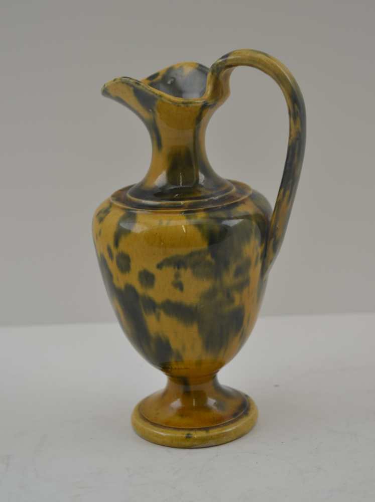 DUNMORE POTTERY A 19th Century Scottish 'Art Pottery' ewer, in egg and spinach glaze, 17cm high,