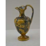 DUNMORE POTTERY A 19th Century Scottish 'Art Pottery' ewer, in egg and spinach glaze, 17cm high,