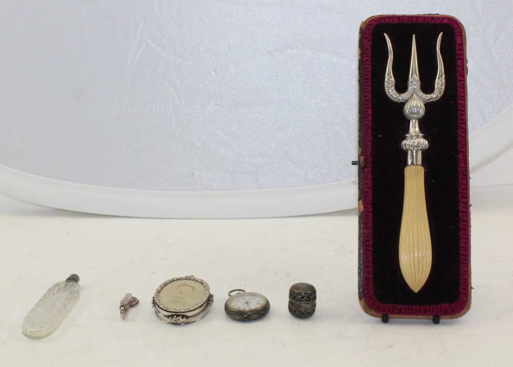 A LATE VICTORIAN SILVER MOUNTED BREAD FORK, together with; a sterling thimble case with ring