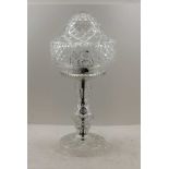 A CUT GLASS TABLE LAMP with globe shade, 43cm high