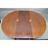 A 19TH CENTURY INLAID MAHOGANY OVAL DINING TABLE, having two 'D' shaped end pieces, with single