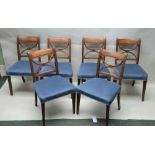 A SET OF SIX LATE REGENCY MAHOGANY SINGLE CHAIRS having 'X' form design backs, overstuffed seat pads