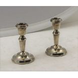 A PAIR OF SILVER CANDLESTICKS of tapering stem form on beaded circular platform bases, Birmingham