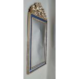 A 20TH CENTURY WALL MIRROR, carved and silvered finish frame with fruit & floral crest, the frame