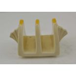 A CLARICE CLIFF POTTERY TWO SECTION TOAST RACK of Art Deco form, hand painted decoration of lines