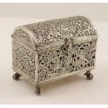 A DUTCH SILVER TABLE CASKET, domed hinged cover, cast, pierced design with birds and flowers, a mask