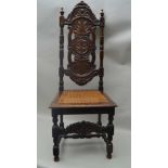 A VICTORIAN OAK JACOBEAN DESIGNED SINGLE CHAIR, having well carved high back, with bergere seat,