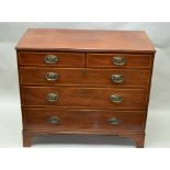 A 19TH CENTURY MAHOGANY CHEST OF FIVE DRAWERS two short over three graduated drawers, stamped oval