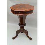 A VICTORIAN INLAID WALNUT OCTAGONAL TOPPED WORK TABLE, having lift-up lid on a tapering faceted