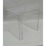 A MODERNIST NEST OF THREE PERSPEX TABLES the tallest 40cm high