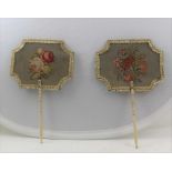 A PAIR OF EARLY 19TH CENTURY HAND HELD FACE SCREENS, turned ivory handles, the panels floral wool