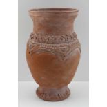 A BYZANTINE TERRACOTTA VASE of baluster form, impressed decorative collar and circular footed
