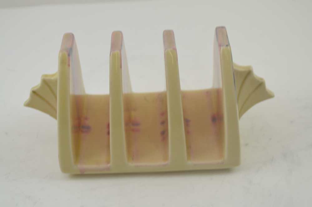 A CLARICE CLIFF NEWPORT POTTERY THREE SECTION TOAST RACK of Art Deco form, hand painted in the '