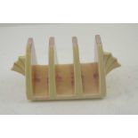 A CLARICE CLIFF NEWPORT POTTERY THREE SECTION TOAST RACK of Art Deco form, hand painted in the '
