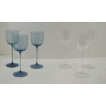 A SET OF THREE ' KING'S LYNN' BLUE TINTED FINE STEMMED WINE GLASSES and a similar set of three clear
