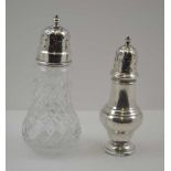 A GEORGIAN DESIGN SILVER SUGAR CASTER of baluster form, 14cm high, Birmingham 1923, together with