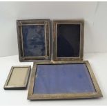 A COLLECTION OF SILVER MOUNTED PHOTOGRAPH FRAMES, various hallmarks, sizes, and designs, the largest