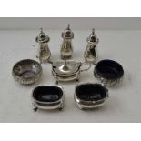 A PAIR OF EDWARDIAN CIRCULAR SILVER SALTS, with repousse rims, Sheffield 1905, together with various