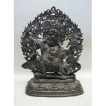 AN EARLY 19TH CENTURY BRONZE TIBETAN FIGURE, a fierce Buddhist guardian figure, depicted standing