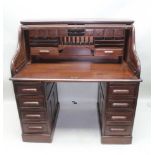 A FIRST QUARTER 20TH CENTURY ROLL TOP TWIN PEDESTAL DESK, with well fitted compartmentalised
