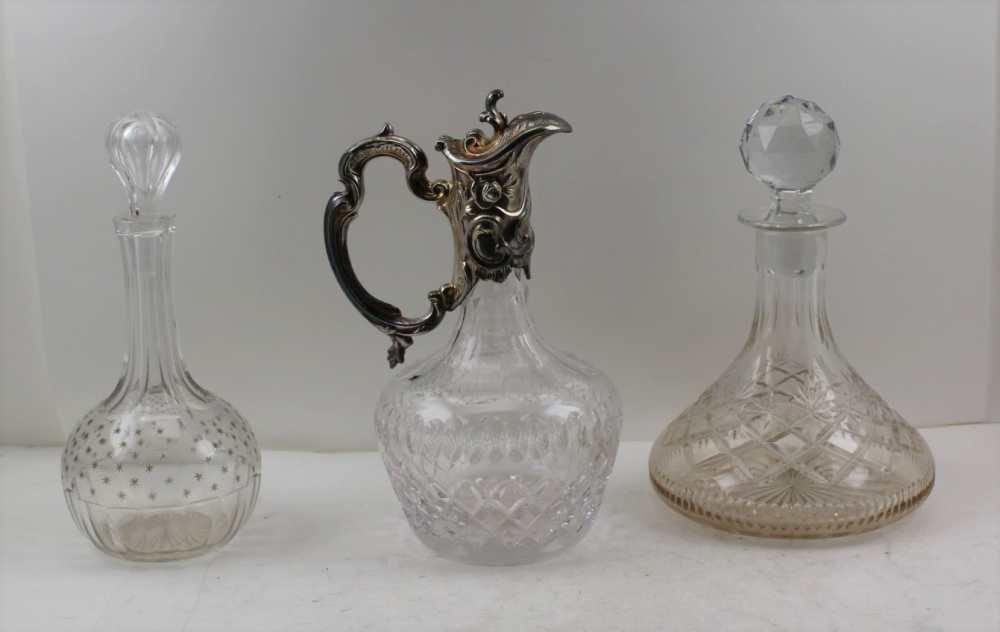 A THOMAS WEBB CUT GLASS SHIPS DECANTER with ball stopper, together with a claret jug with silver
