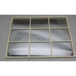 A MODERN OFF WHITE FRAMED NINE PANELLED WALL MIRROR, 83cm x 110cm