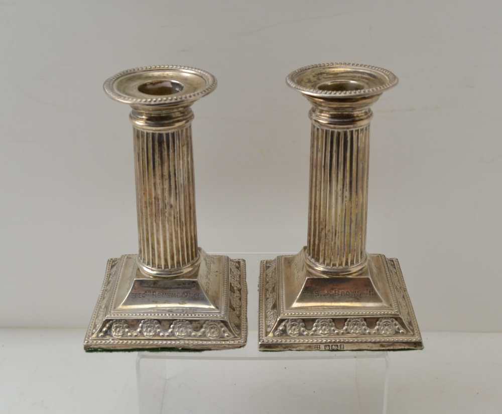 JAMES DEAKIN & SONS, A PAIR OF SILVER COLUMN CANDLESTICKS, square stepped bases, Sheffield 1902,