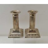 JAMES DEAKIN & SONS, A PAIR OF SILVER COLUMN CANDLESTICKS, square stepped bases, Sheffield 1902,