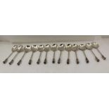 FRANK FINLEY CLARKSON, A SET OF THIRTEEN SEAL TOP APOSTLE SPOONS, cast terminals with dove seal,