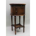 A THEODORE ALEXANDER REPRODUCTION CYLINDRICAL POT CUPBOARD, having leather insert top, over a single
