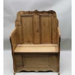 A SCRATCH BUILT PINE SMALL SIZED SETTLE, of box form, having twin panelled upright back, with