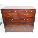 A 19TH CENTURY MAHOGANY MULTI-DRAWER CHEST having plain crossbanded caddy top, over three slender