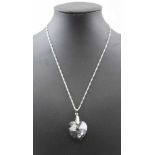 A SWAROVSKI HEART CRYSTAL PENDANT suspended on a white metal chain (in presentation box)