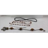 BAG OF BEAD NECKLACES, items considered to be Whitby jet, amber, etc