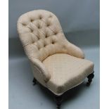 A 19TH CENTURY UPHOLSTERED NURSING CHAIR, with buttermilk, lattice upholstery having button back and