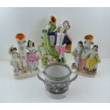 THREE 19TH CENTURY STAFFORDSHIRE POTTERY FLAT BACK SPILL HOLDERS, the tallest a shepherd and