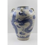 A CHINESE SWATOW OR ZANGZHOU WARE GLAZED BLUE PAINTED CERAMIC VASE, strap work handles to the