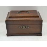 A GEORGE III MAHOGANY TABLE CASKET, brass swan neck handle to the hinged cover, raised on bracket
