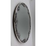 A STERLING SILVER FRAMED MIRRORED PLATEAU, the oval frame with raised acanthus leaves and