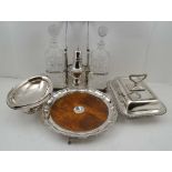 A SELECTION OF SILVER PLATED WARES, to include; an oak base salver with plated pie-crust rim on claw
