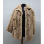 A LADY'S BLOND MINK FUR SHORT JACKET, together with extra brace clip, approx. 70cm drop