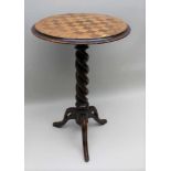 A VICTORIAN CIRCULAR TOPPED CHESS TABLE, with insert board, supported on a barley twist column and