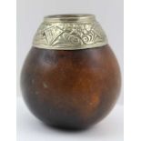 AN 18TH / 19TH CENTURY SOUTH SEA GOURD BOWL with white metal mounted collar, 8cm high