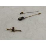 A BAROQUE PEARL AND EMANEL STICK PIN, one other stick pin, and a 9ct gold insect brooch, stone and