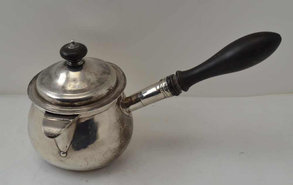 THOMAS RADCLIFFE A George III silver covered pan, with turned ebony side handle, London 1810,