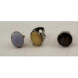 THREE WHITE METAL SILVER DRESS RINGS each set with polished stones