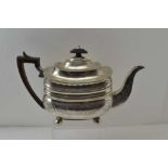 JOHN DOUGLAS A George III silver teapot, waisted rectangular form, floral chased decoration, on ball