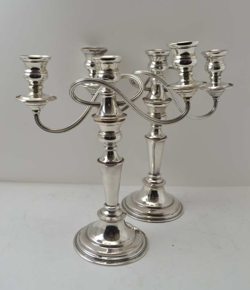 A PAIR OF SILVER ON COPPER CANDELABRA of Georgian design, each stick with a removable twin branch,