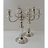 A PAIR OF SILVER ON COPPER CANDELABRA of Georgian design, each stick with a removable twin branch,