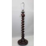 A 19TH CENTURY MAHOGANY BARLEY TWIST COLUMN, converted to a standard lamp, on associated stepped